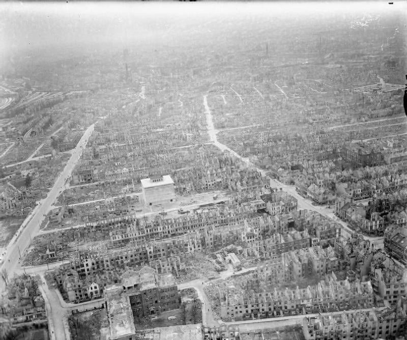 An aerial reconnaissance photograph of Bremen showing the docks along the river and the dense city around them.