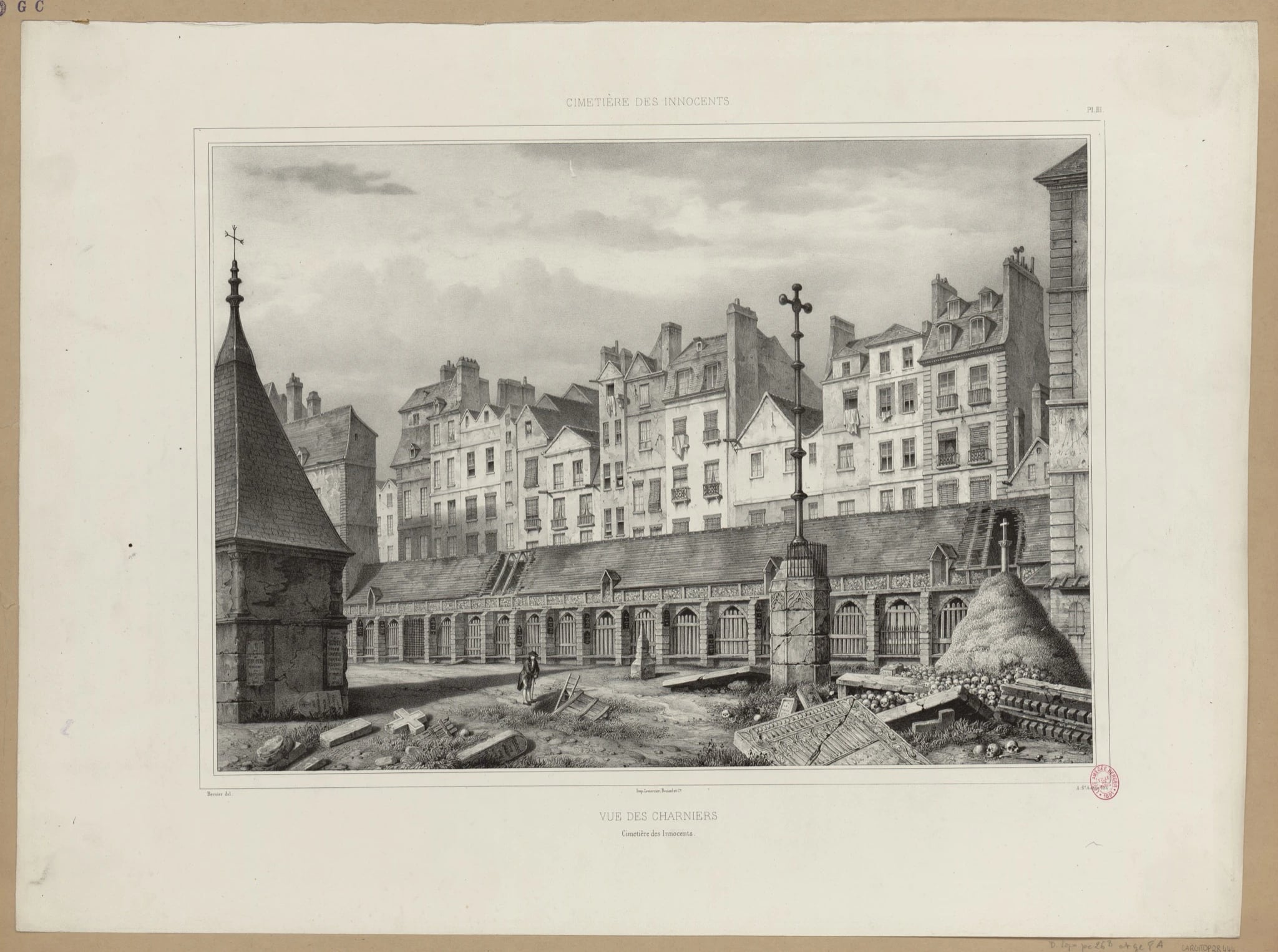 A grey lithograph of a long arcaded gallery running the length of a cemetery wall, its arches open and its roof low, with tall Paris houses rising behind. Broken tombstones lie on bare earth in the foreground beside a tall wrought-iron cross, and a mound of skulls and bones is heaped against the right-hand end of the arcade.
