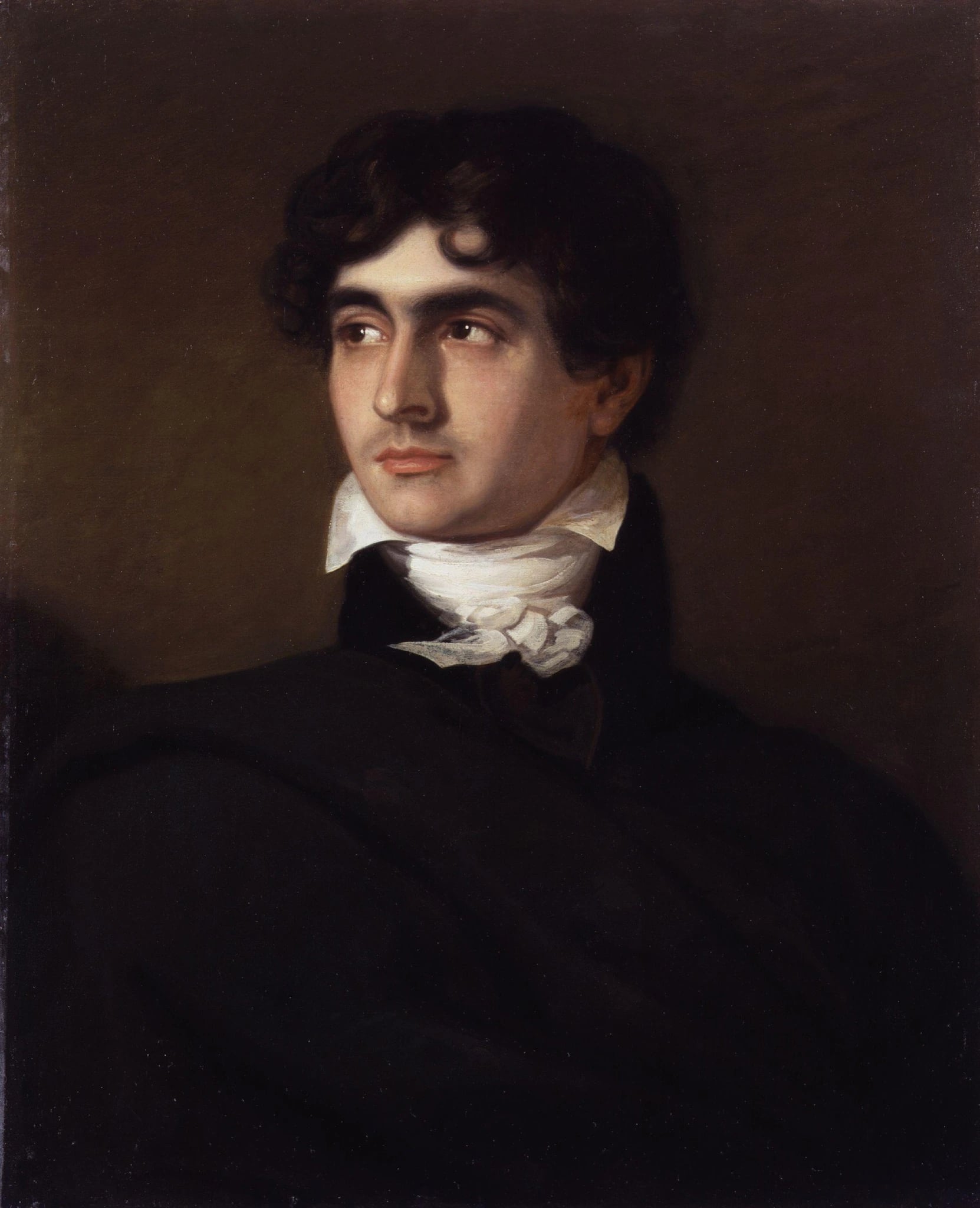 An oil portrait of a young man against a plain olive-brown ground, turned three-quarters to his right. He has thick dark curling hair, dark eyes, and wears a black coat and a high white cravat tied loosely at the throat.
