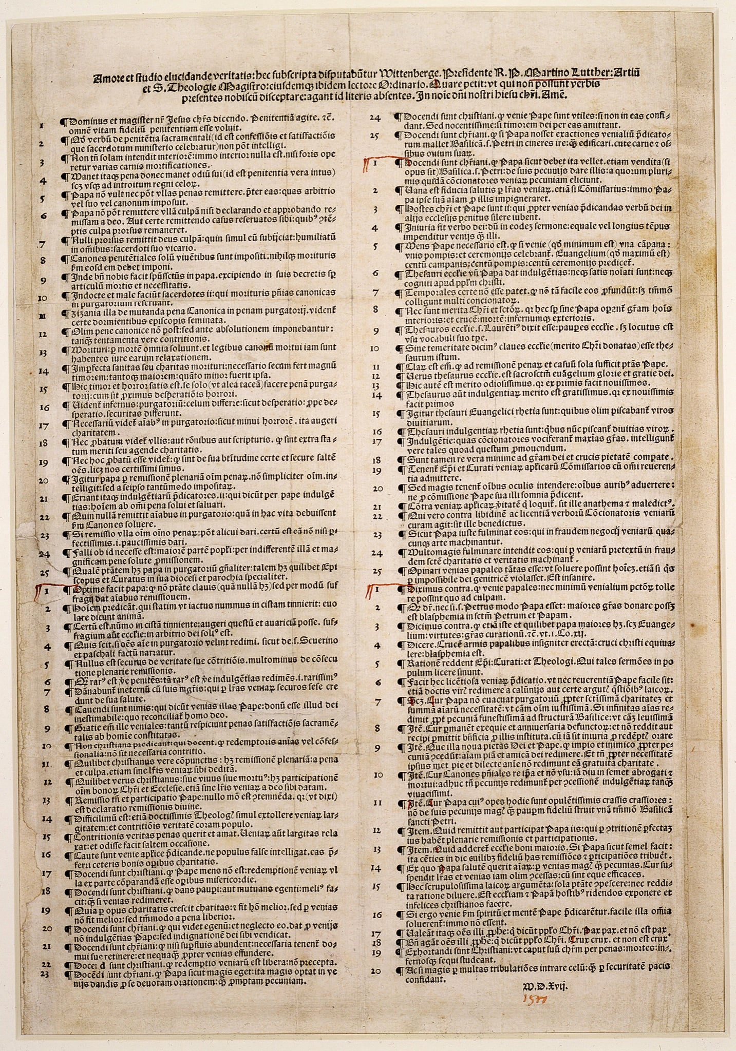 A single large printed sheet, browned with age, headed by three lines of larger Latin type and filled with ninety-five short numbered propositions in two dense columns of small gothic type. A few red pen marks appear in the margins, and the date M.D.Xvij is printed at the foot.